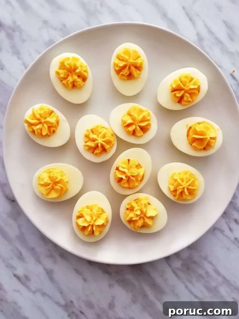 Classic Southern Deviled Eggs Recipe for Gatherings 3 deviled eggs on plate overhead