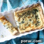 Quiche Florentine with Fresh Spinach and Gruyère Cheese 3 Quiche florentine in a baking dish.