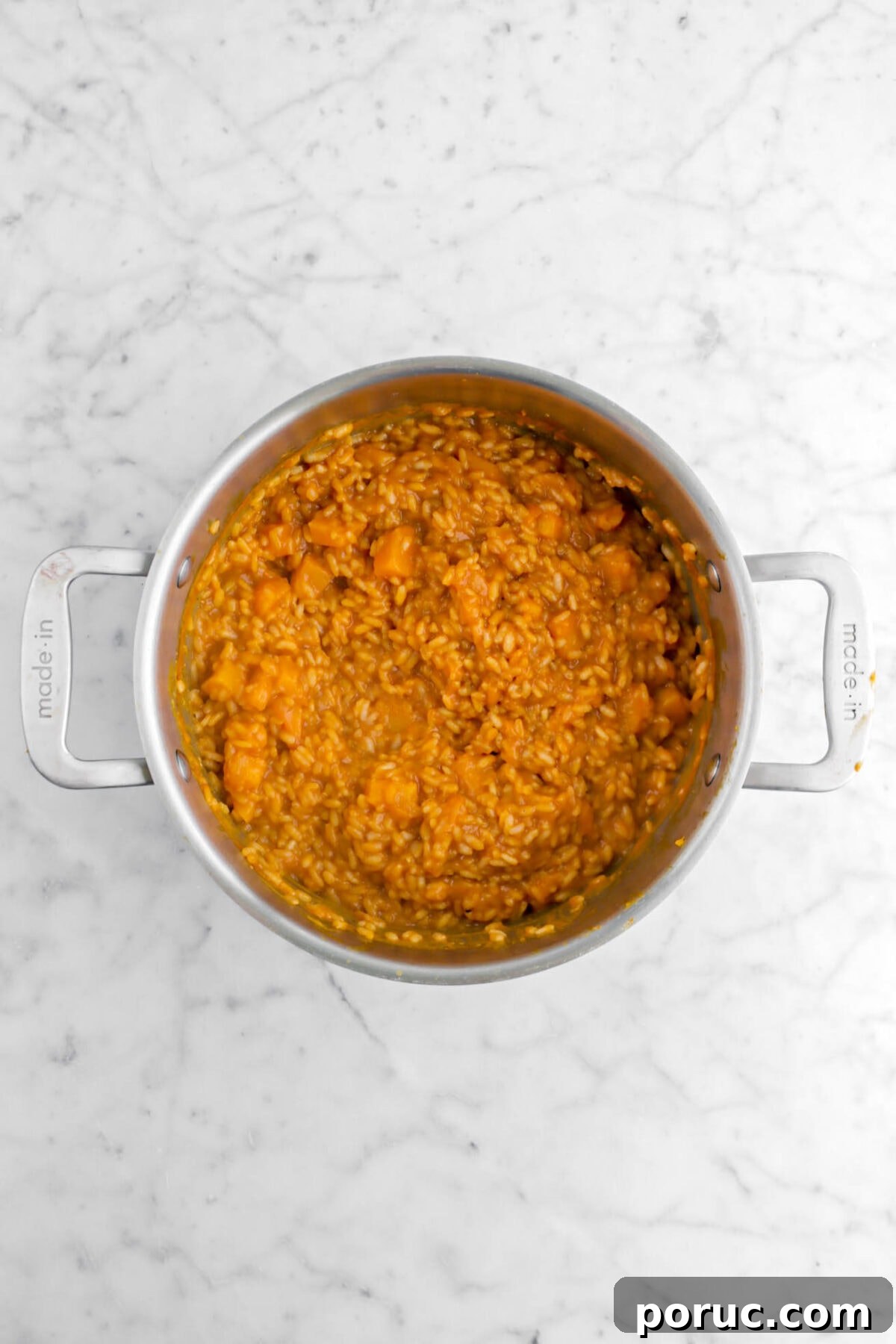 Creamy Roasted Butternut Squash Risotto Recipe 9 butternut squash risotto in large pot on marble surface.