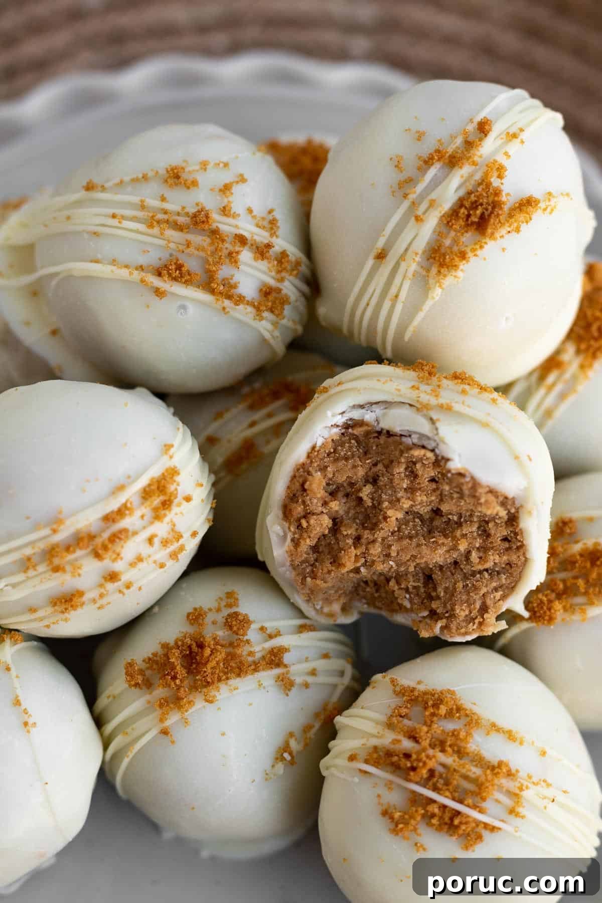 Decadent Biscoff Truffles Recipe: No-Bake Chocolate Treats 2 A pile of Biscoff truffles dipped in white chocolate and sprinkled with Biscoff cookie crumbs
