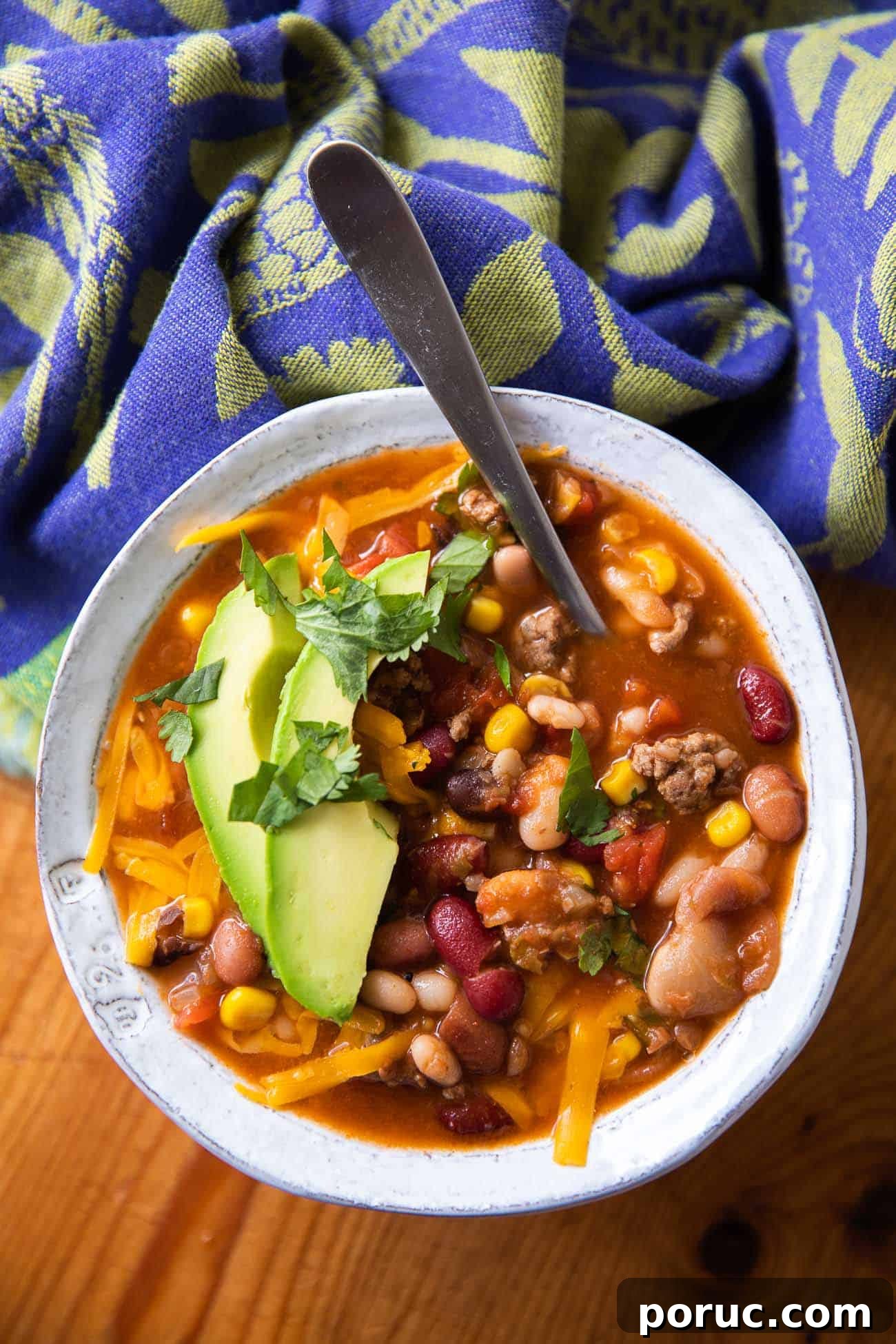 Hearty 15-Bean Taco Soup Recipe for Flavorful Weeknight Dinners 4 overhead photo of soup with beans, meat and cheese
