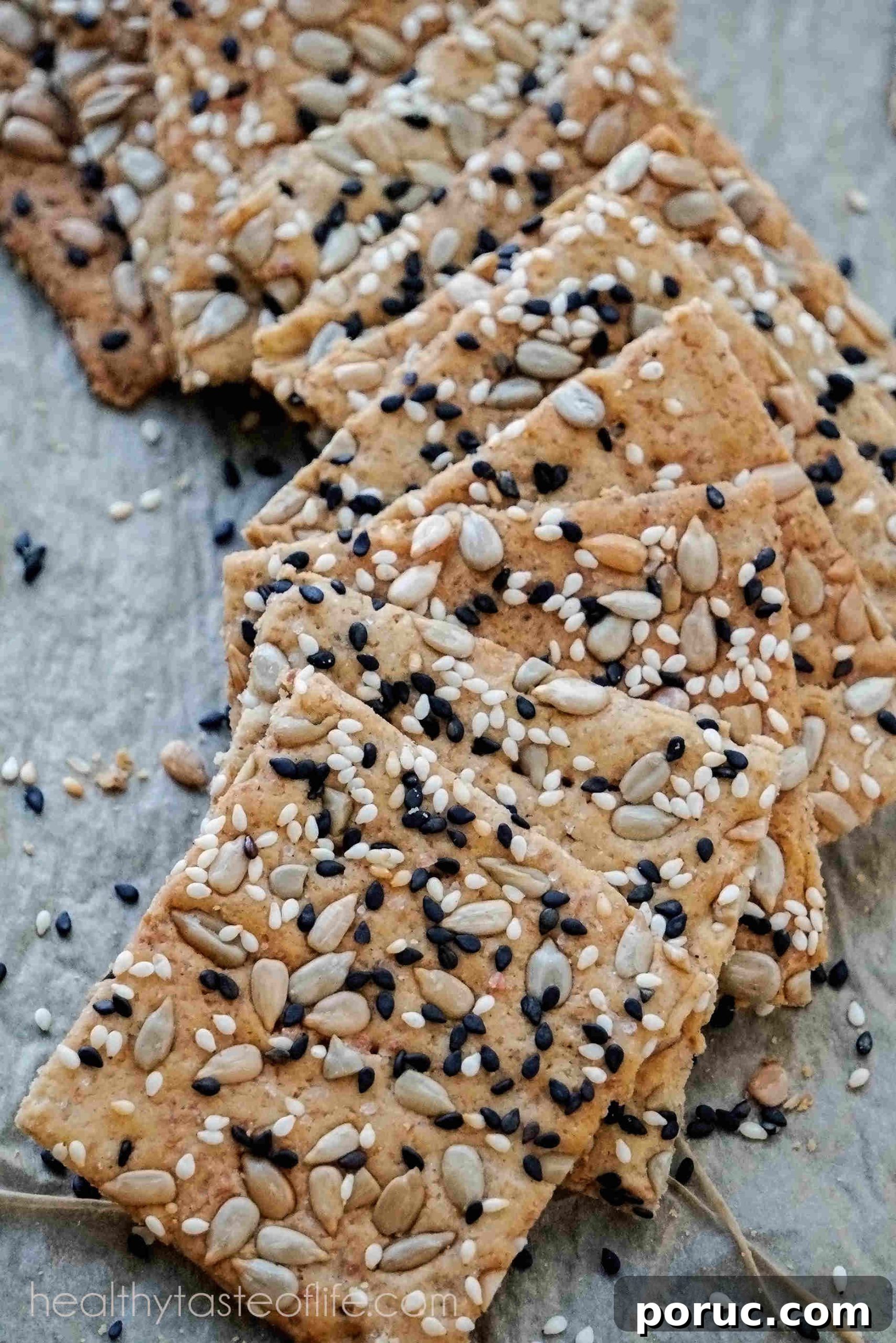 Vegan Seeded Gluten-Free Sourdough Crackers Recipe 3 homemade gluten free crackers with a mix of flours and seeds