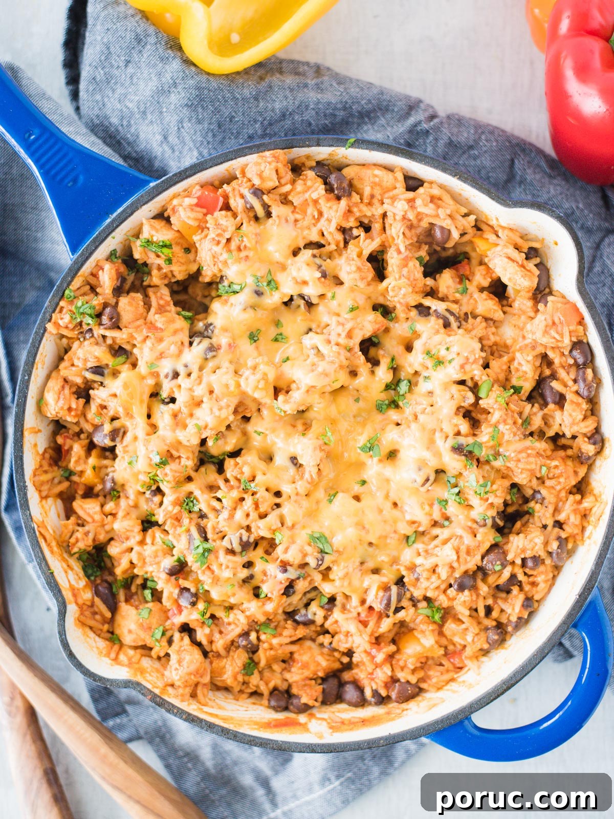 Southwest Chicken Skillet Recipe with Peppers and Black Beans 2 Enamel cast iron skillet with the recipe inside.