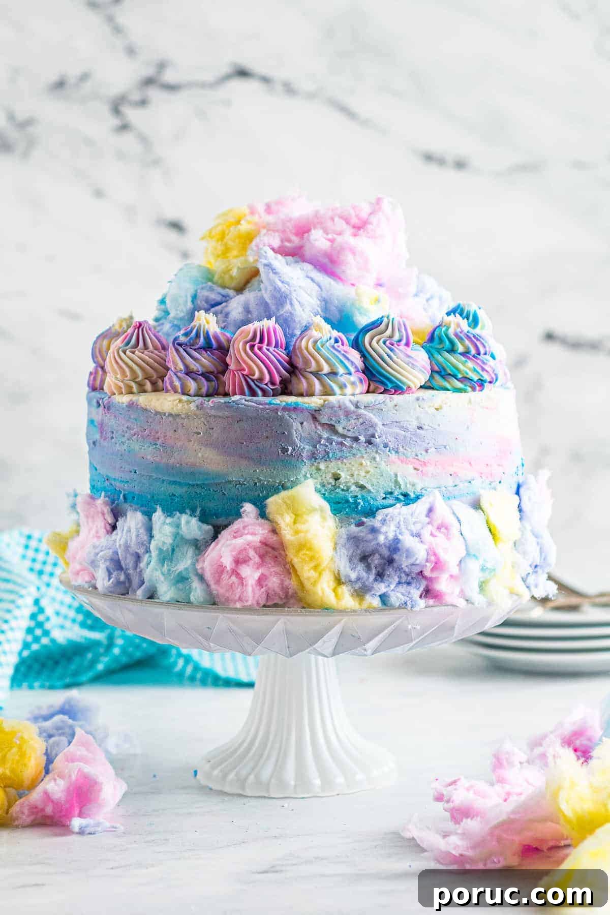 Whipped Cotton Candy Cake Recipe for Celebratory Parties 2 Decorated cotton candy cake on cake stand.