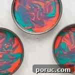 Whipped Cotton Candy Cake Recipe for Celebratory Parties 9 swirled pink and blue cake batter in a round cake pan.