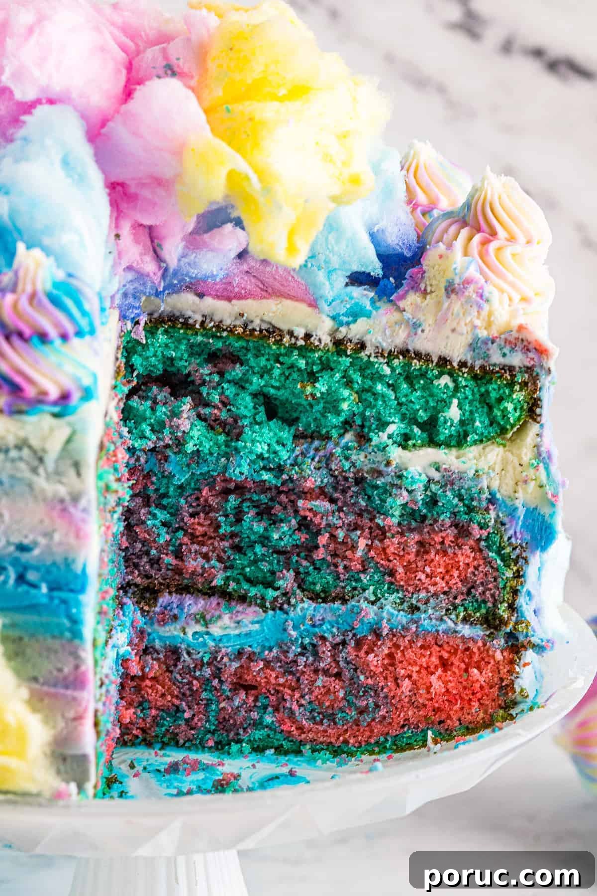 Whipped Cotton Candy Cake Recipe for Celebratory Parties 3 Cotton candy cake cut to show the pink and blue layers.