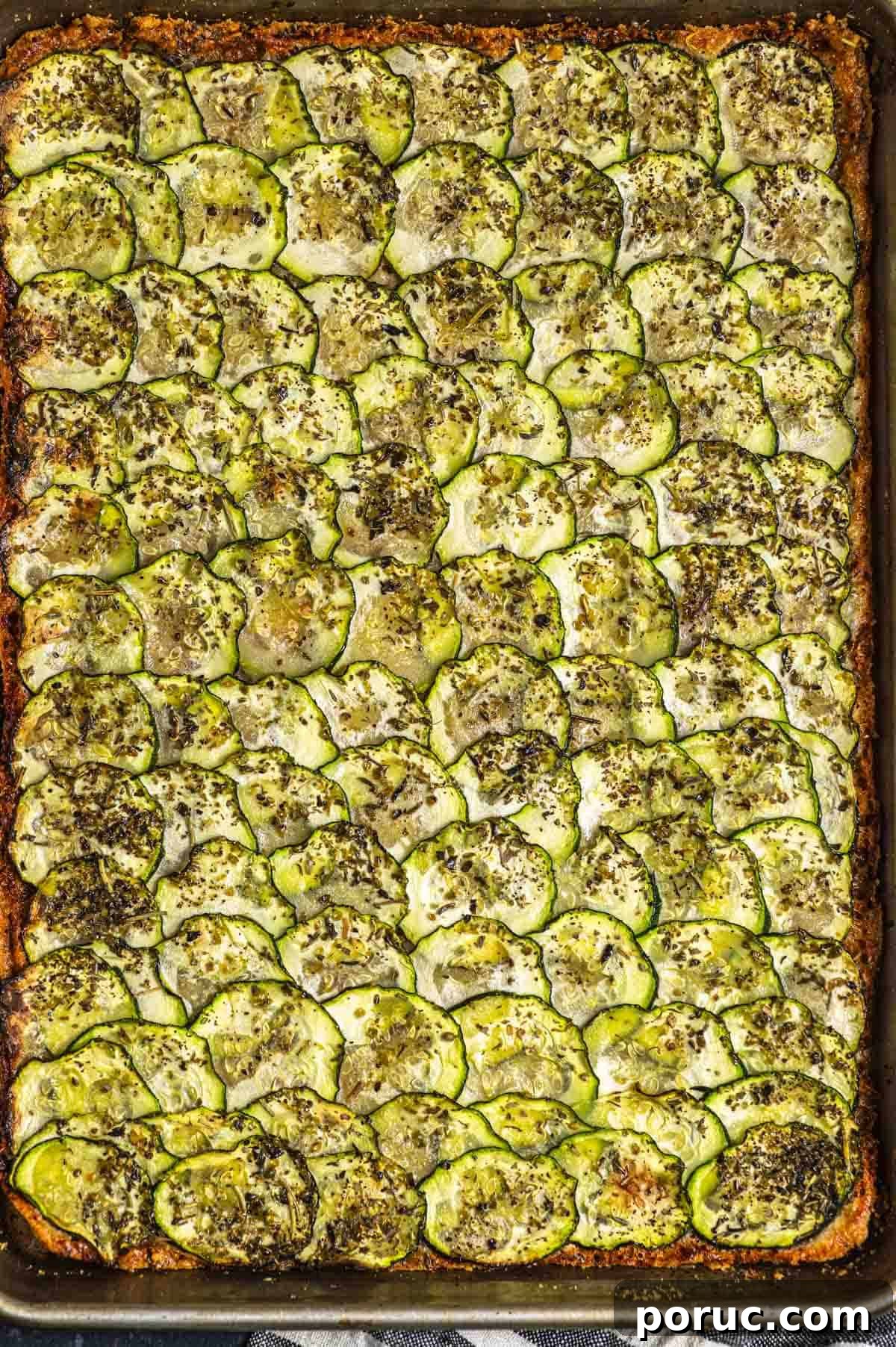 Crispy Parmesan Baked Zucchini Slices 6 Close up view of a baking sheet with baked parmesan zucchini
