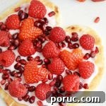Make this healthy Yogurt Flatbread Pizza Heart to show someone you care. It is a sweet breakfast or snack any time of year, especially for Valentine's Day!