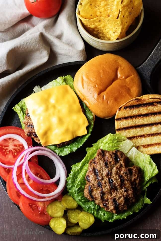 Homemade Hamburger Recipe: Juicy Patties and Perfect Buns 3 Homemade Hamburgers on buns with toppings laid out.