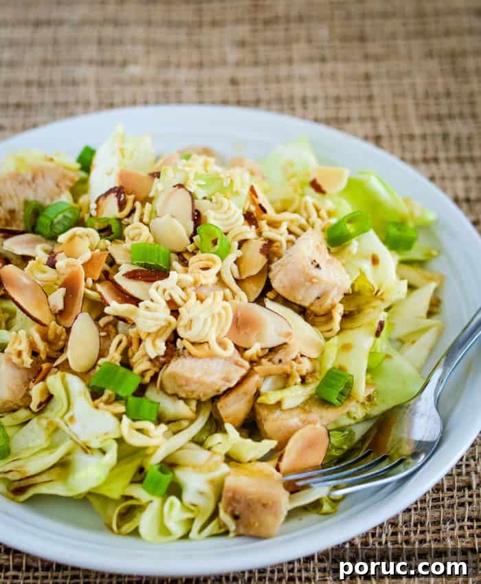 This Chinese Chicken Salad is crunchy, flavorful, and healthy! chinese ramen salad on a plate with a fork