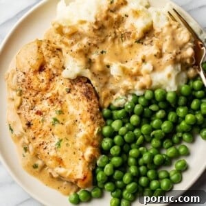 Creamy Boursin Chicken with Garlic and Herbs 8 Boursin chicken plated with peas and mashed potatoes