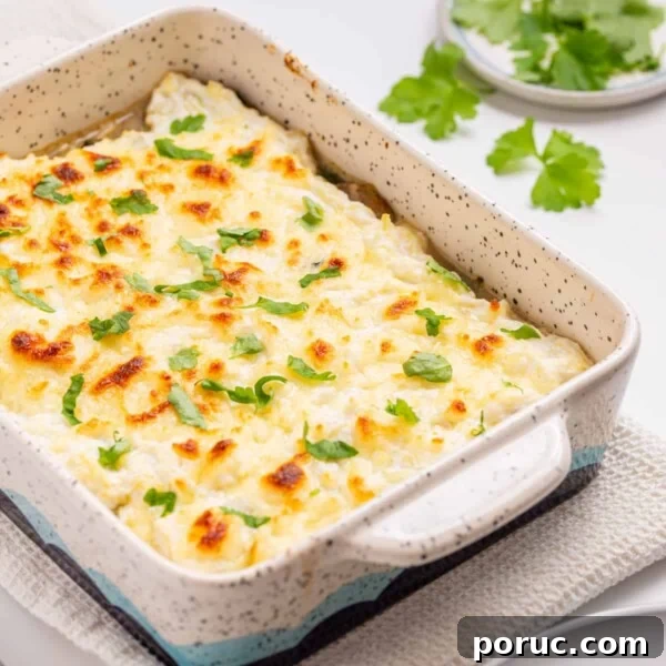 An angled image of spaghetti squash casserole with fresh basil leaves on top.