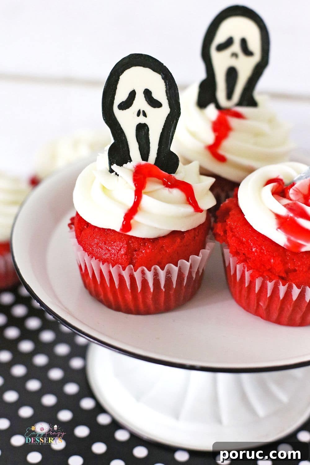 Bloody Halloween Cupcakes with Scream Faces and Knife Toppers 3 Scream cupcakes on a cupcake plate