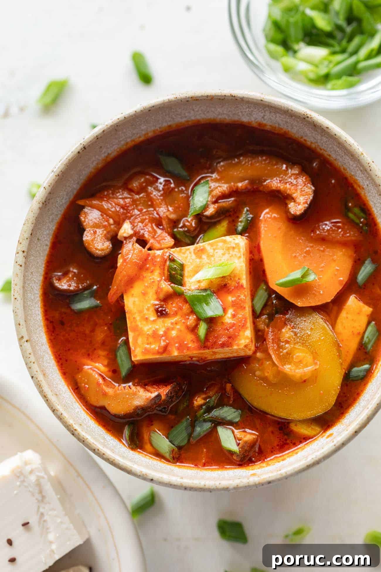 Soondubu Jjigae: Korean Soft Tofu Stew Recipe & Serving Tips 2 korean soft tofu stew in a white bowl