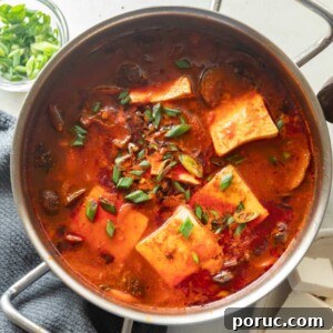 Soondubu Jjigae: Korean Soft Tofu Stew Recipe & Serving Tips 7 Soondubu jjigae served in the pot it was cooked in