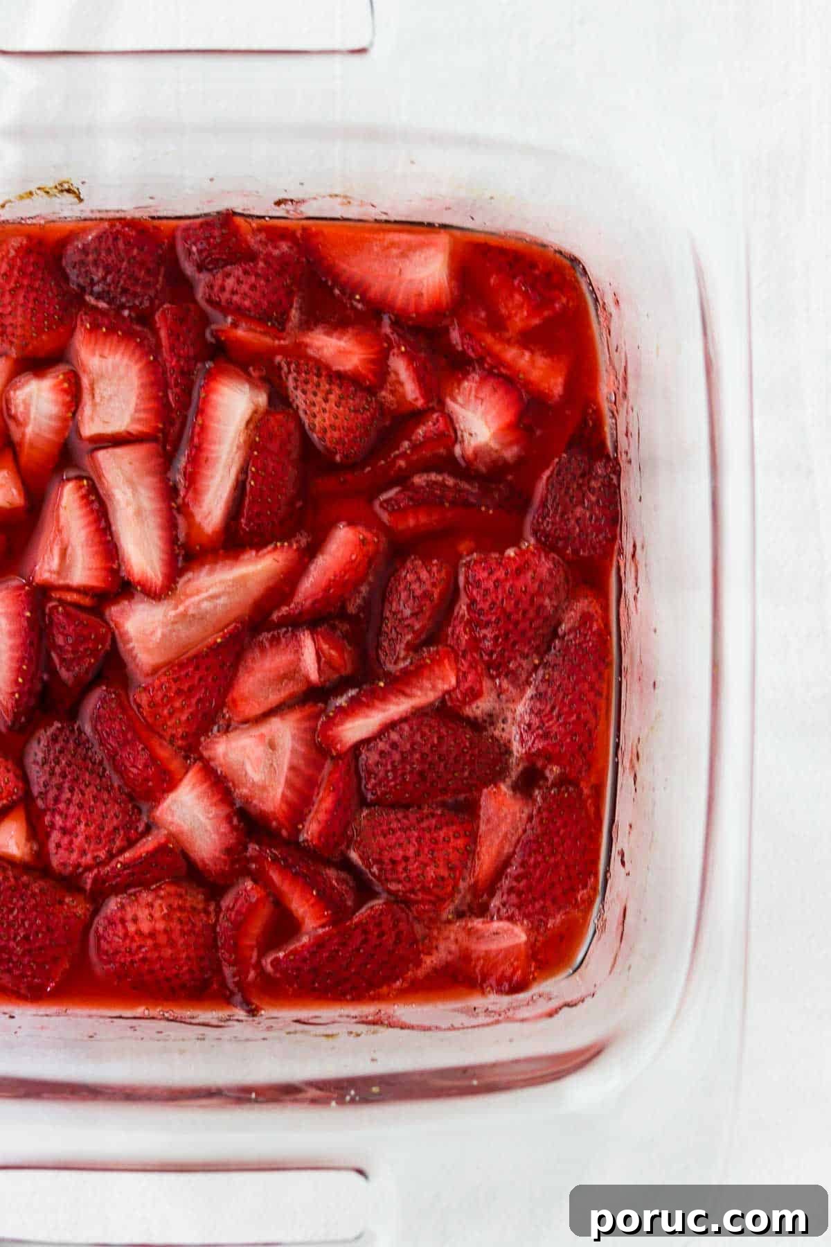 Vanilla Layer Cake with Strawberry Filling — Swedish Midsummer Cake 8 Roasted strawberries in a glass baking dish.