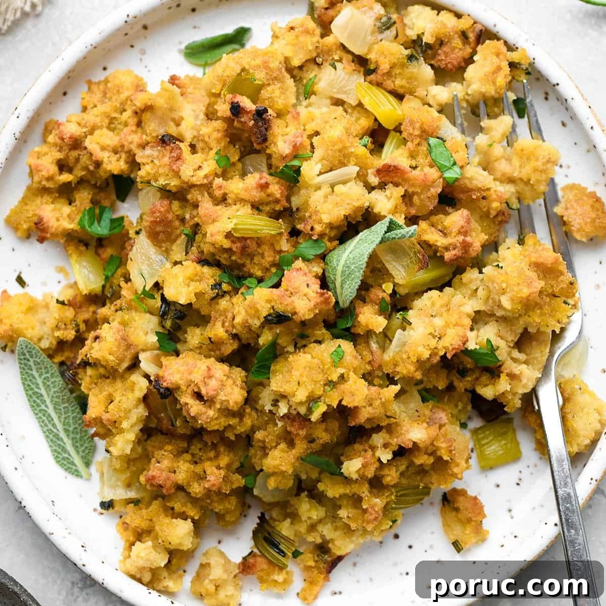 Southern Cornbread Dressing Recipe — Classic Holiday Side Dish 12 a plate of Cornbread Dressing with fresh herbs