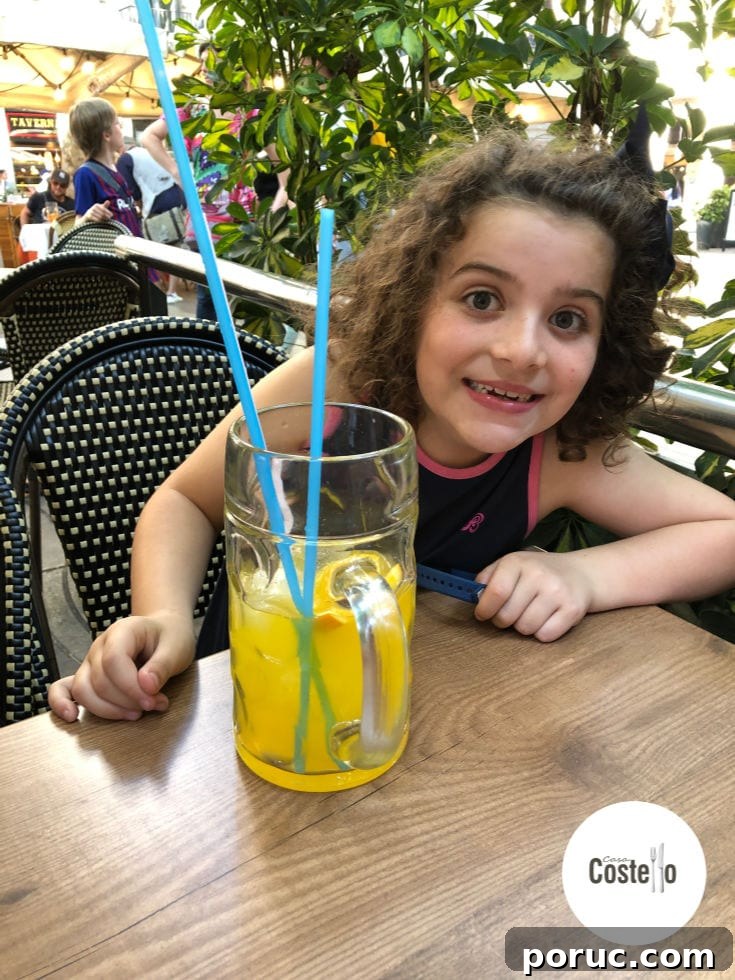 Help Kids Stay Hydrated in Hot Weather: Tips for Parents 2 Smiley child dinking juice