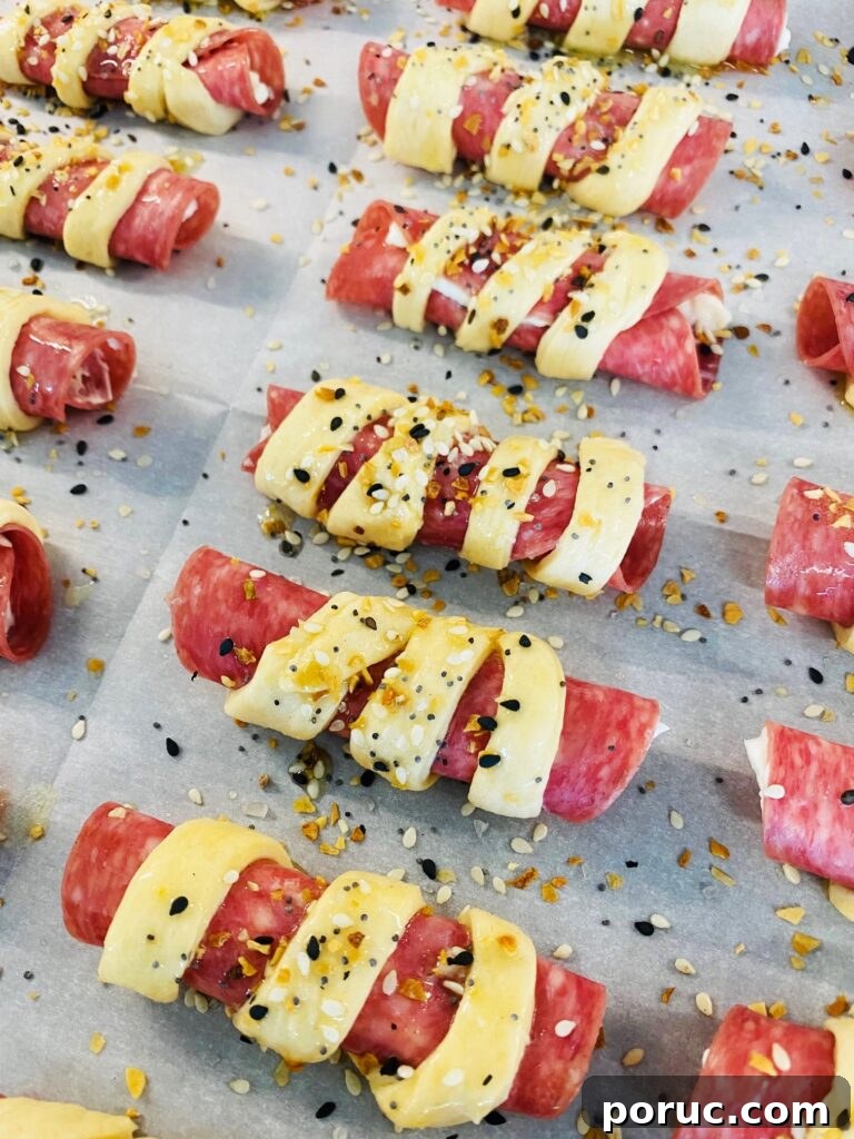 Savory Crescent Salami Roll-Ups for Appetizers and Parties 8 adding everything bagel seasoning over top