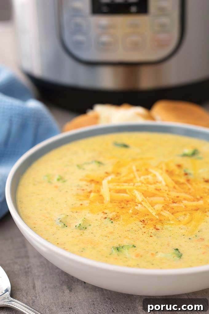 Creamy Broccoli Cheddar Soup in the Instant Pot: Fast Recipe 3 Instant Pot Broccoli Cheddar Soup in a white bowl in front of IP