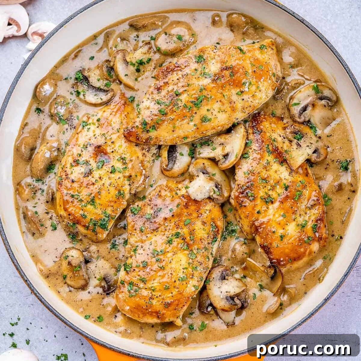 One pan filled with balsamic chicken skillet and mushrooms