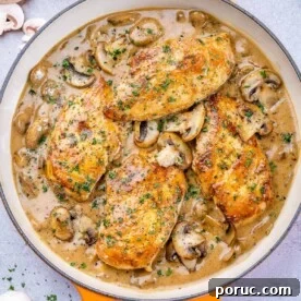 One pan filled with balsamic chicken skillet and mushrooms
