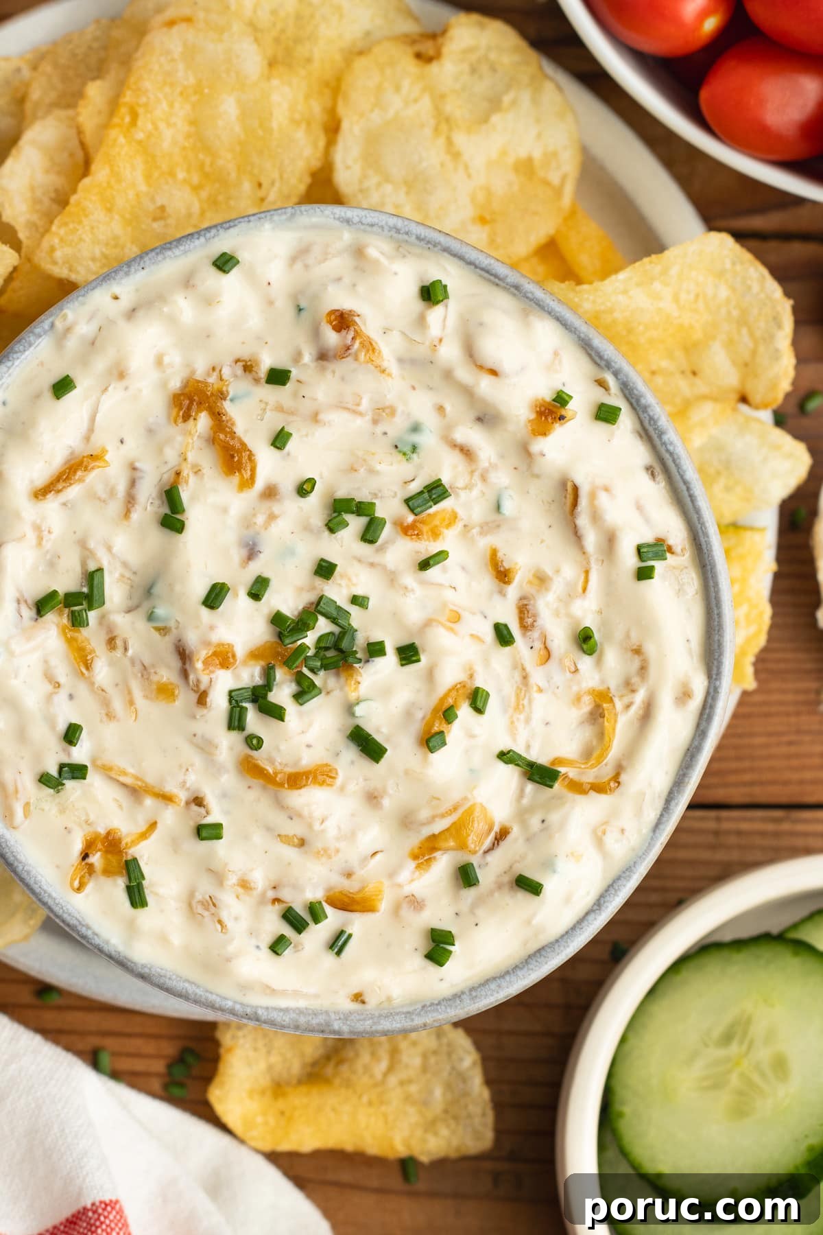 Creamy Caramelized Onion Dip with Greek Yogurt 2 This is a picture of the caramelized onion dip with greek yogurt surrounded with chips and veggies.