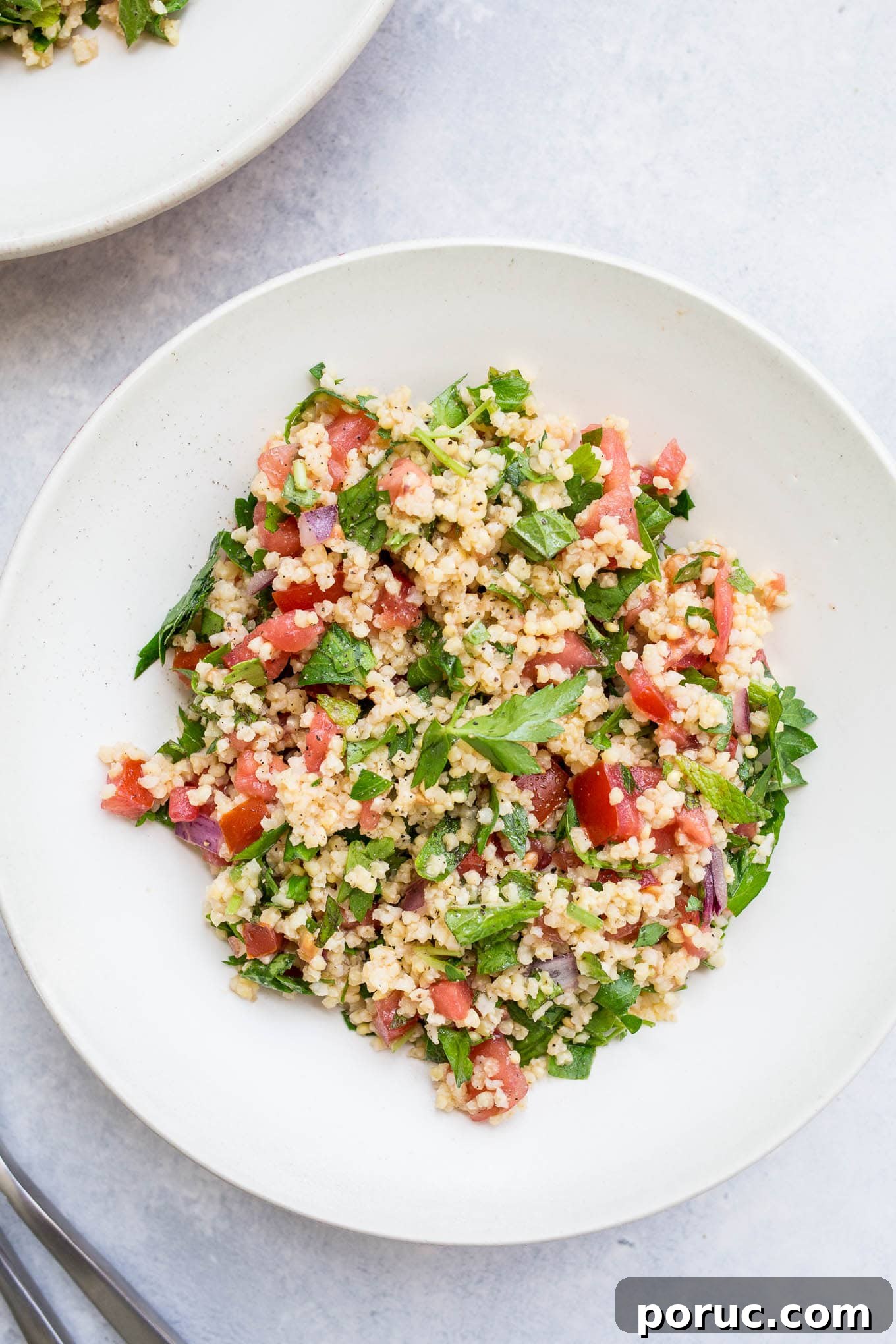 Gluten-Free Vegan Millet Tabbouleh Salad Recipe 2 Millet salad in a white bowl.