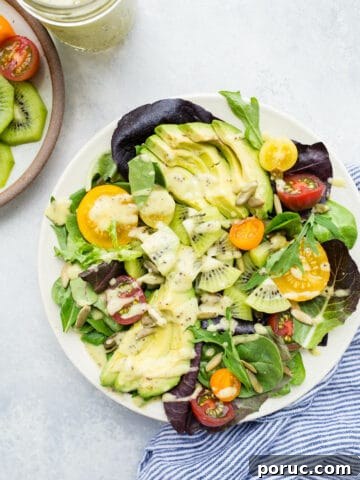 Green salad on a white plate.