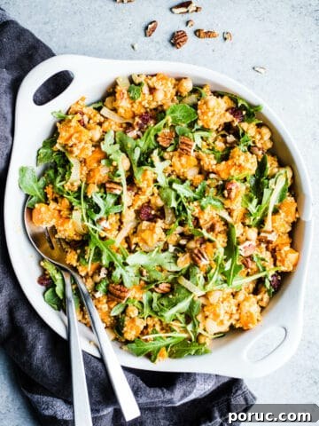 A grain salad in a white dish.