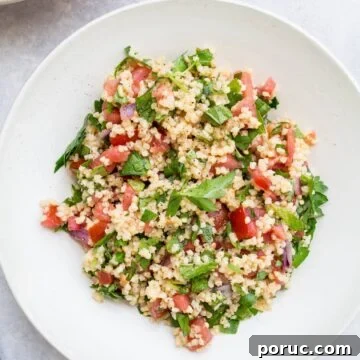 Gluten-Free Vegan Millet Tabbouleh Salad Recipe 10 Millet salad in a white bowl.