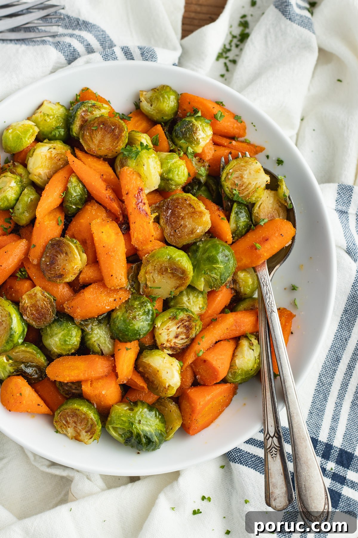 Spicy Honey-Roasted Brussels Sprouts and Carrots 2 This is a picture of a plate filled with roasted Brussels sprouts and carrots with hot honey.