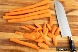 Spicy Honey-Roasted Brussels Sprouts and Carrots 12 This is a picture of carrots being chopped.