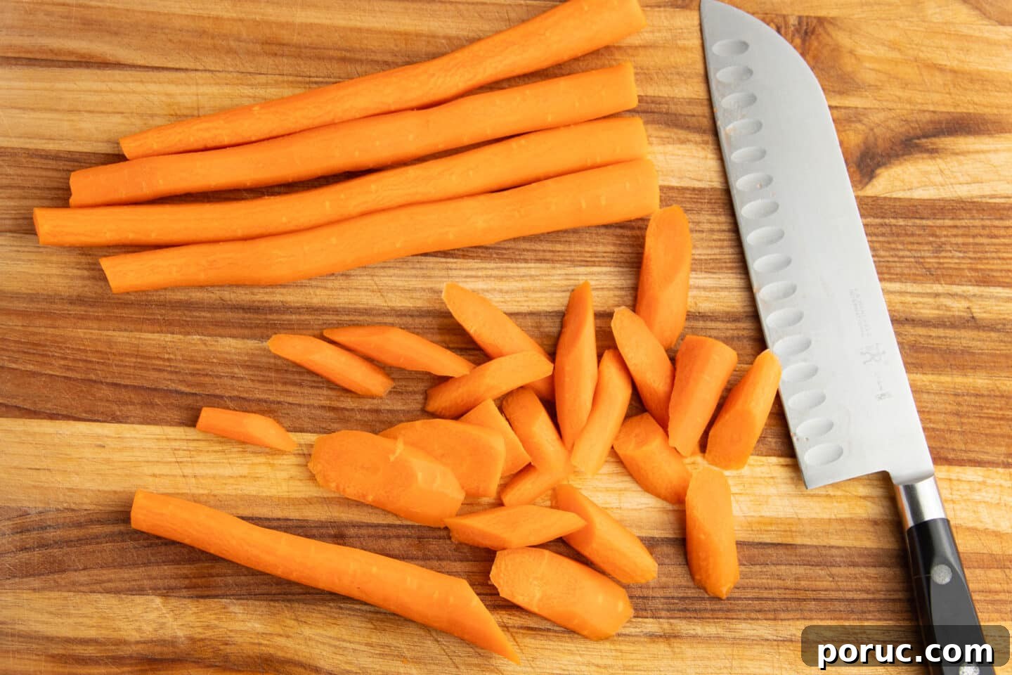 Spicy Honey-Roasted Brussels Sprouts and Carrots 5 This is a picture of carrots being chopped.