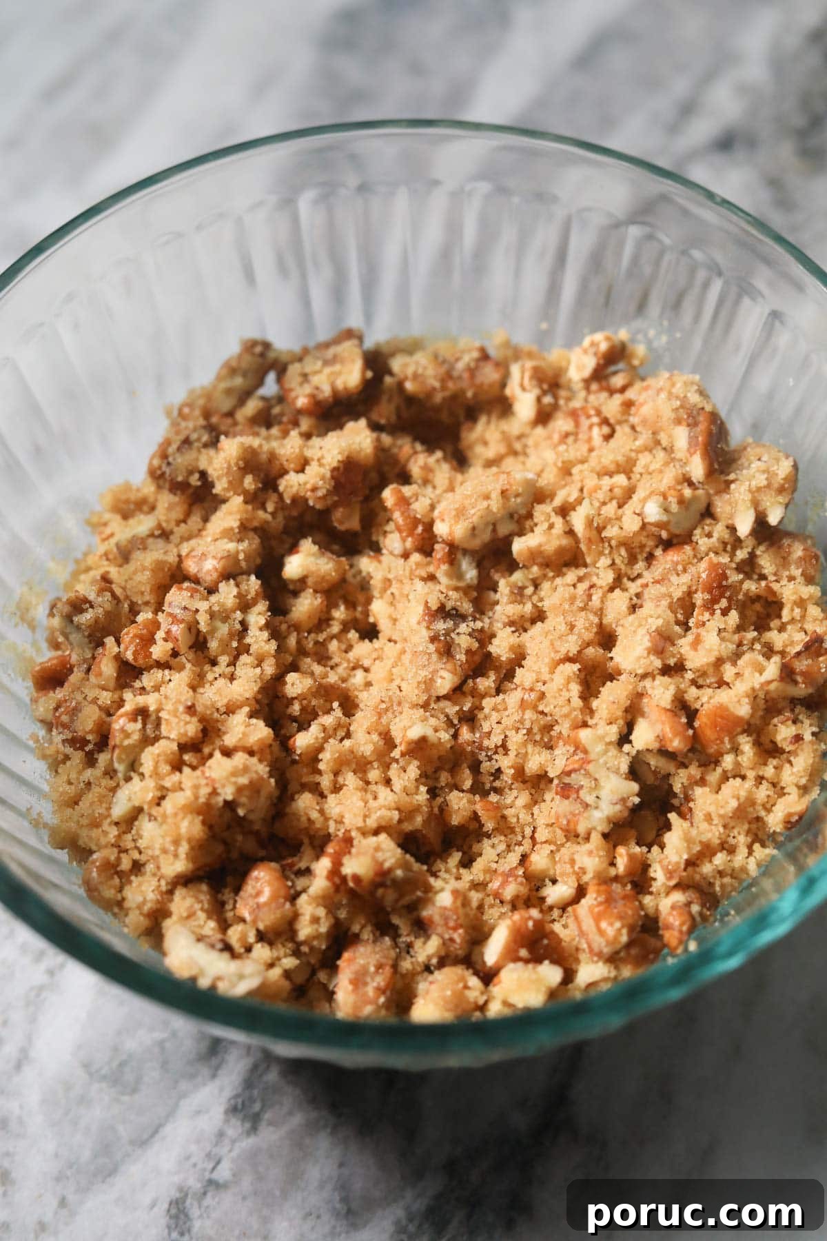 Southern Sweet Potato Casserole with Pecan Crumble Recipe 6 Pecan crumble topping for sweet potato casserole in a small mixing bowl.