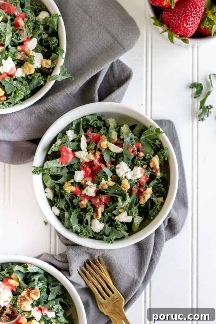 Strawberry Vinaigrette Recipe for Paleo Salads 5 Image shows two bowls of kale salad with strawberry vinaigrette dressing