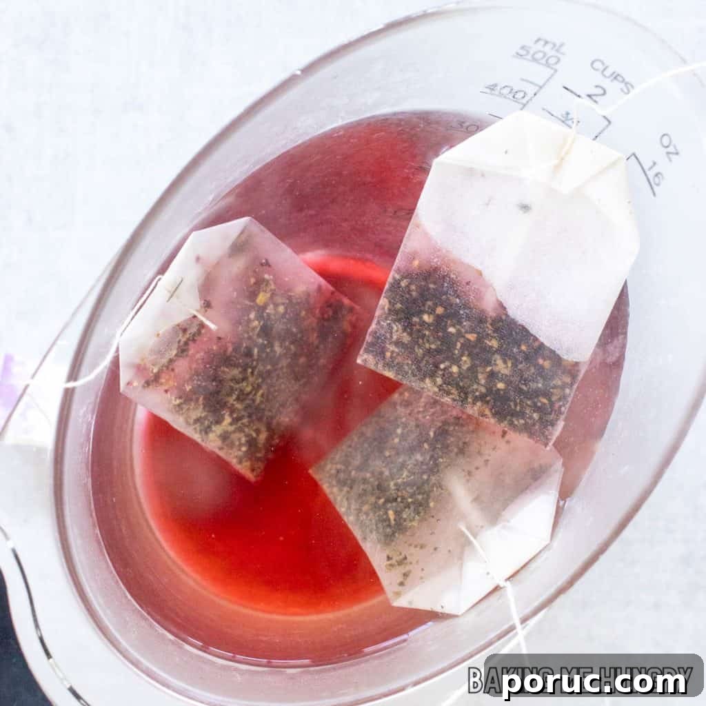 Starbucks-Style Hibiscus Refresher Recipe — How to Make It at Home 5 tea bags steeping in hot water
