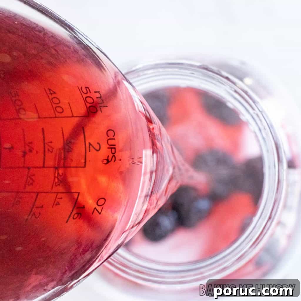 Starbucks-Style Hibiscus Refresher Recipe — How to Make It at Home 7 tea being added to jar