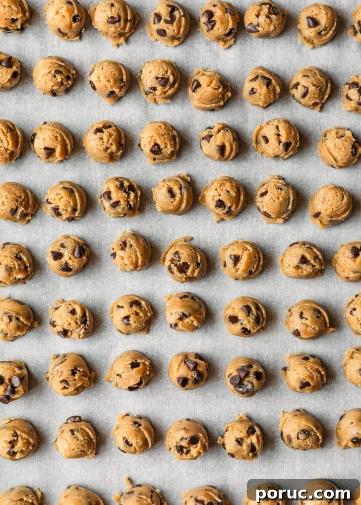 Chewy Mini Chocolate Chip Cookie Recipe for Perfect Bites 18 Raw mini chocolate chip cookies on a sheet pan.