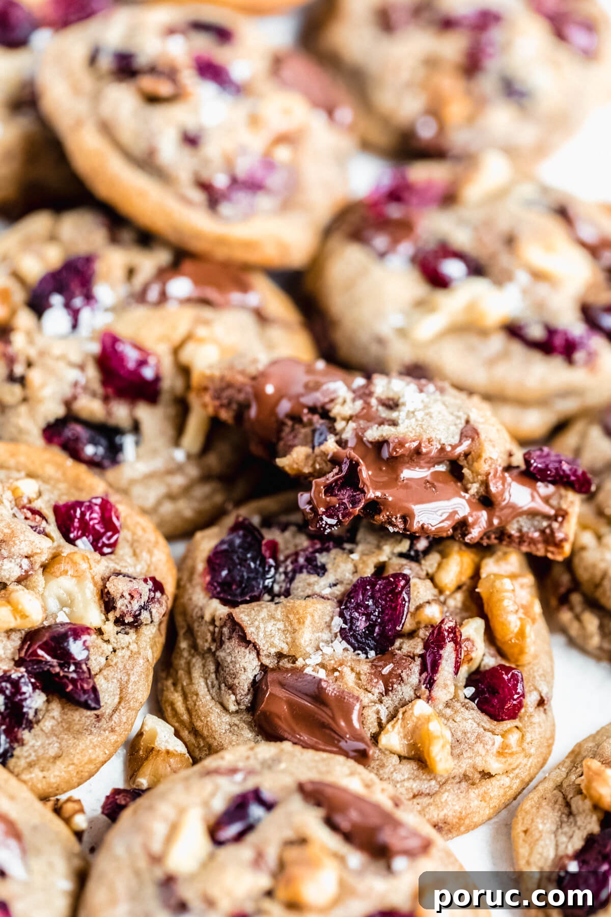 half eaten cookie on top of many other cookies