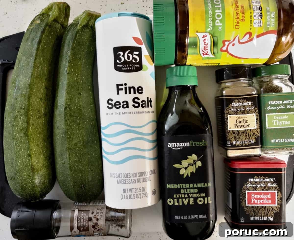 Crispy Air Fryer Zucchini Recipe: Simple Flavorful Side Dish 3 ingredients for air fryer zucchini spread out on cutting board