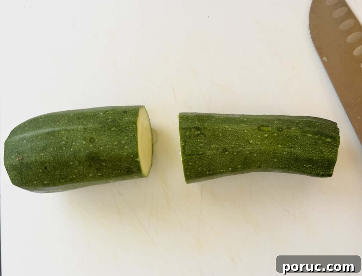 Crispy Air Fryer Zucchini Recipe: Simple Flavorful Side Dish 4 zucchini cut in half step 1