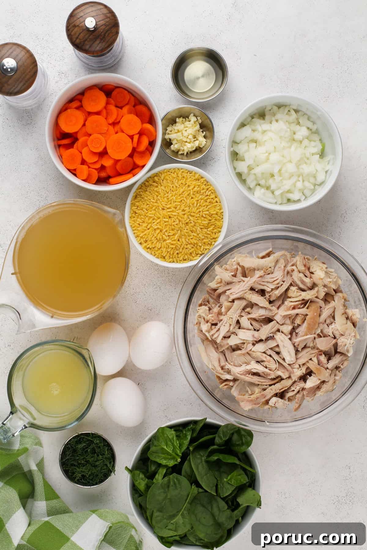 Lemony Chicken and Orzo Soup Recipe for Cozy Meals 5 Ingredients for lemon chicken orzo soup arranged on a countertop.