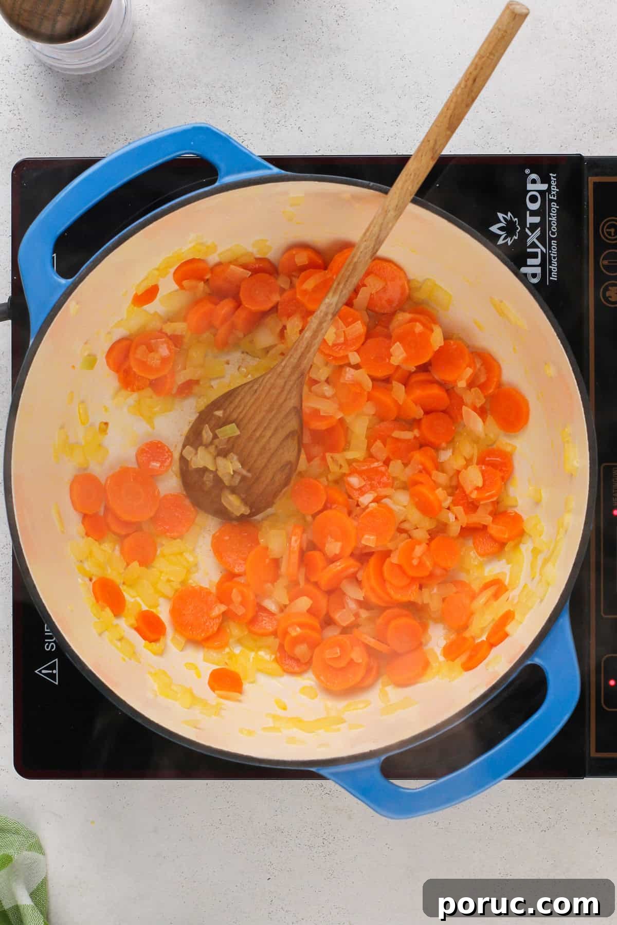 Lemony Chicken and Orzo Soup Recipe for Cozy Meals 6 Carrots and onions sauteed in a dutch oven.