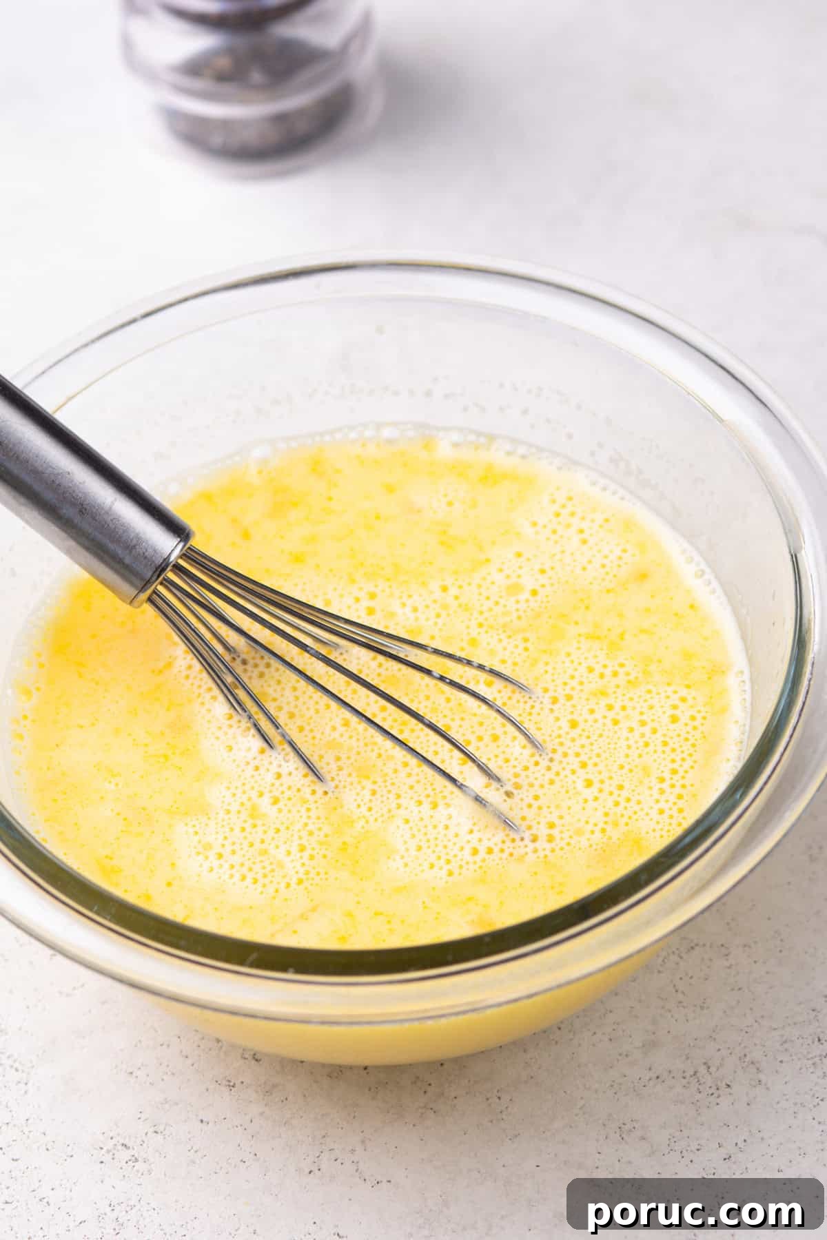 Lemony Chicken and Orzo Soup Recipe for Cozy Meals 8 Eggs and lemon juice whisked together in a bowl.
