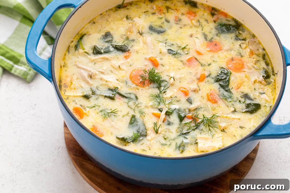 Lemony Chicken and Orzo Soup Recipe for Cozy Meals 10 Blue dutch oven filled with lemon chicken orzo soup.
