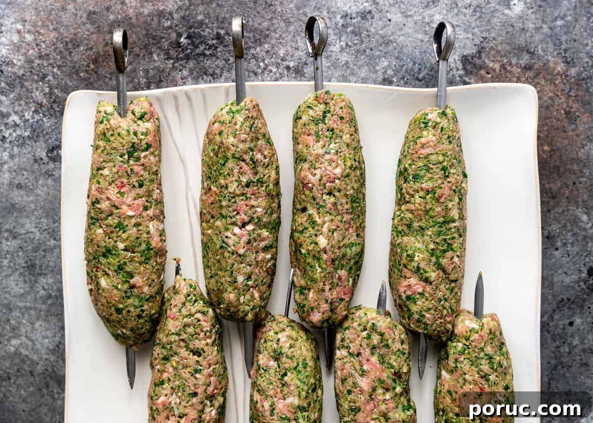 Kefta Kabob Recipe: Flavorful Ground Beef Skewers You’ll Love 5 uncooked mixture of ground beef and North African spices formed around metal kabobs