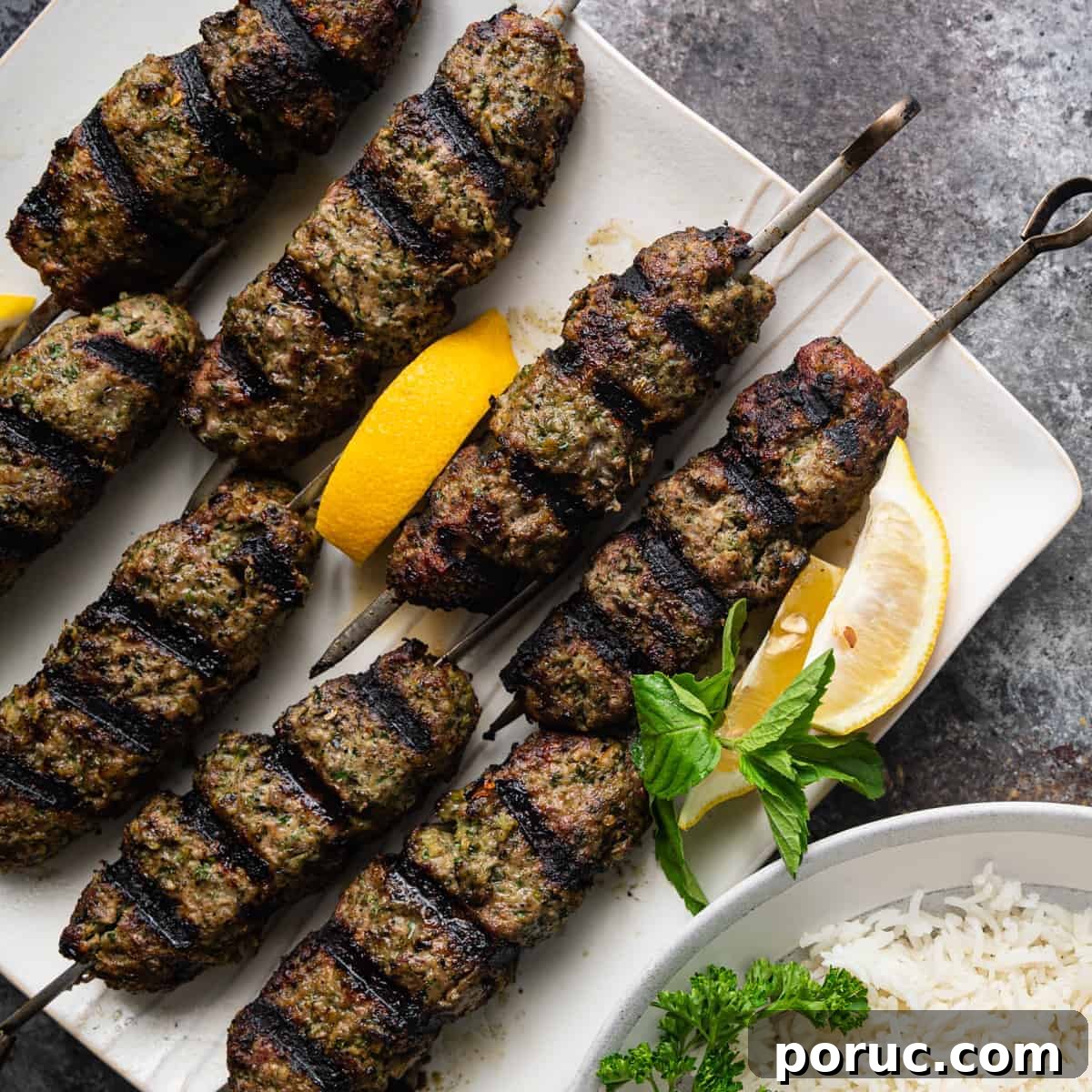 Kefta Kabob Recipe: Flavorful Ground Beef Skewers You’ll Love 6 grilled ground beef kefta shaped around metal skewers