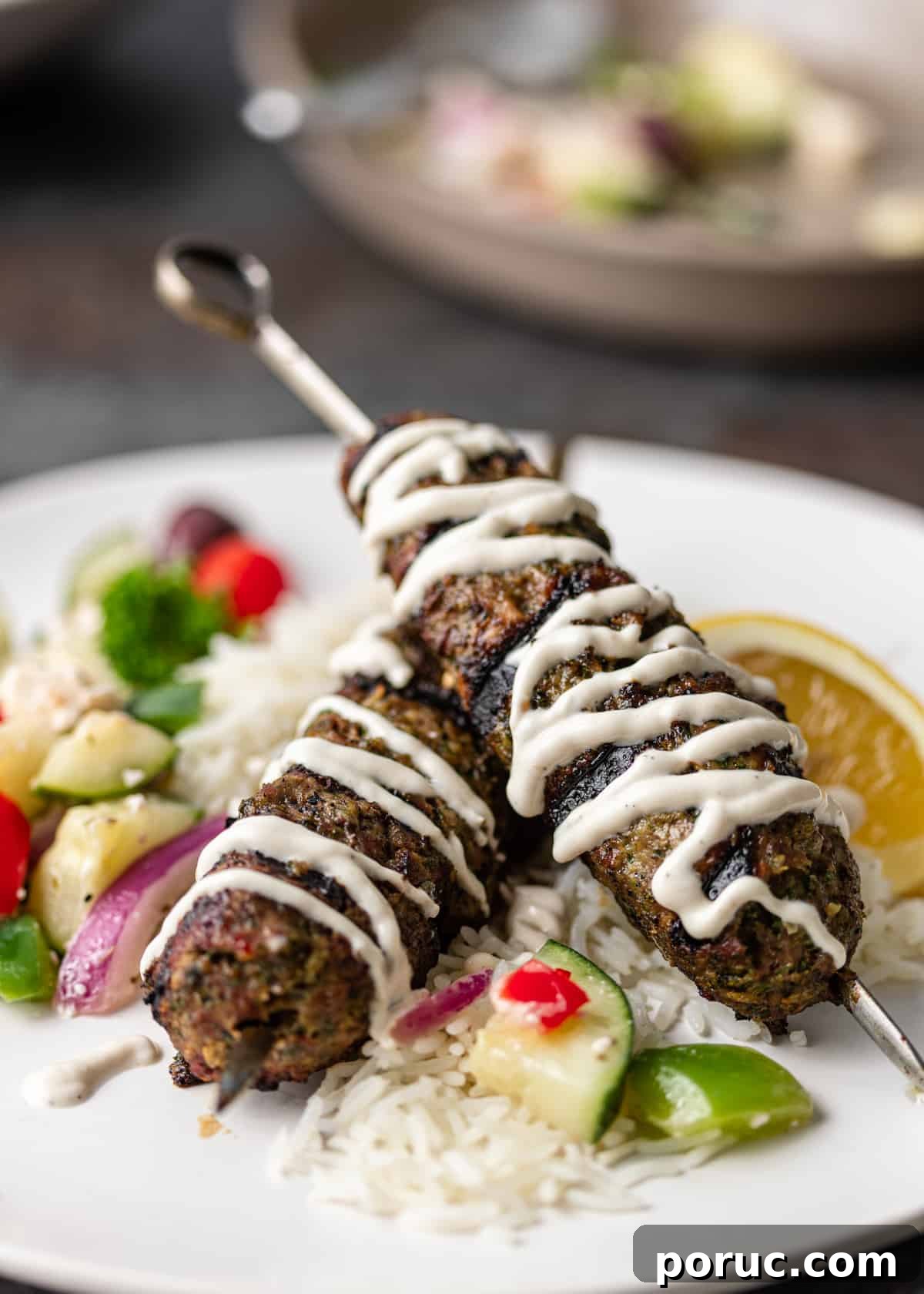 Kefta Kabob Recipe: Flavorful Ground Beef Skewers You’ll Love 7 Moroccan ground beef kabobs plated on metal skewers