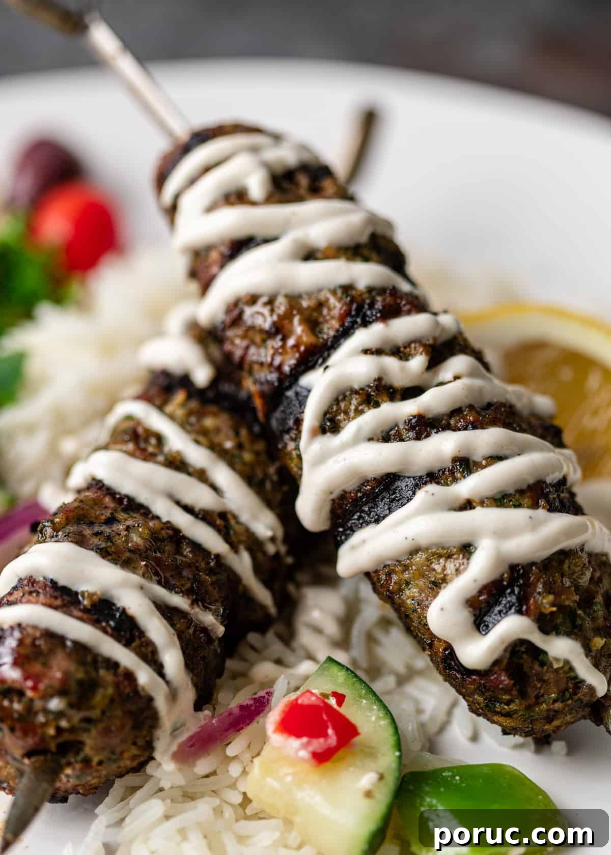 Kefta Kabob Recipe: Flavorful Ground Beef Skewers You’ll Love 8 two ground beef skewers drizzled with yogurt sauce